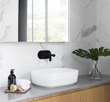 white ceramic sink with faucet