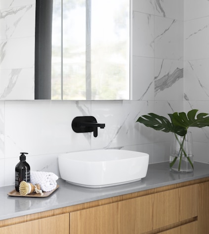 white ceramic sink with faucet
