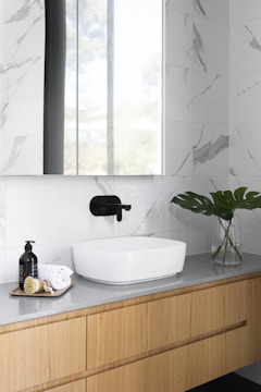 A stylish bathroom countertop made of granite.