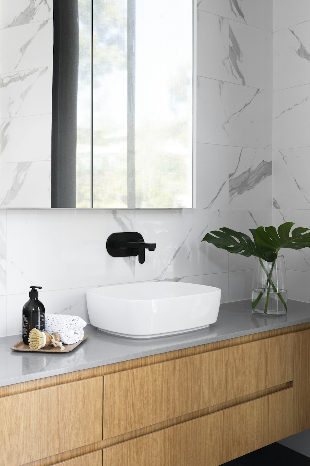 white ceramic sink with faucet