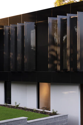 Modern architectural detail of a sleek law office interior with minimalist design and brushed gold accents.