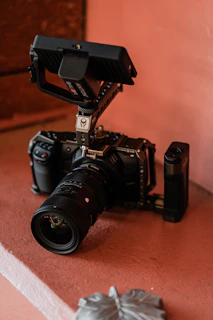 black nikon dslr camera on brown wooden table