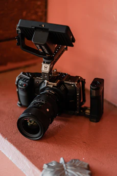 black nikon dslr camera on brown wooden table