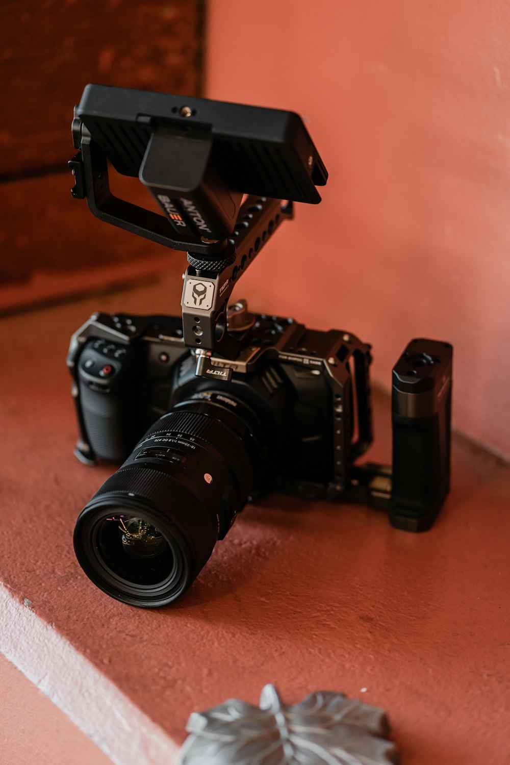 black nikon dslr camera on brown wooden table