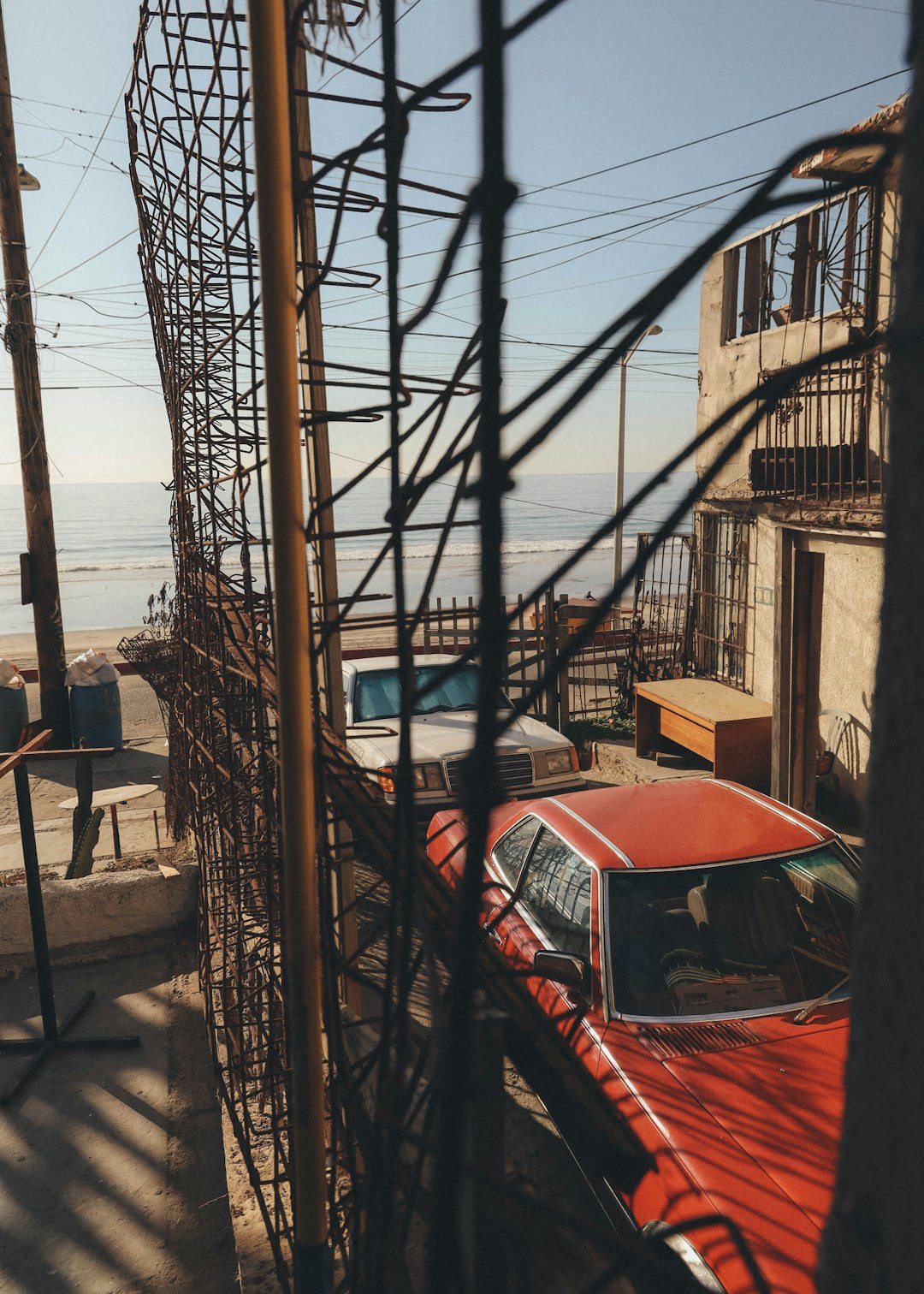 red car parked near building during daytime