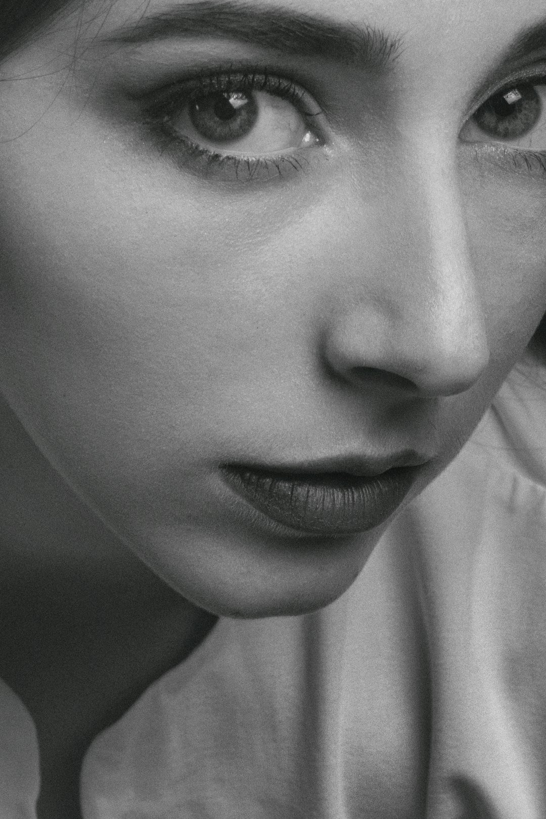 grayscale photo of womans face