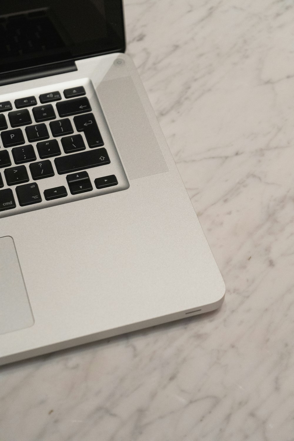 macbook pro on white table