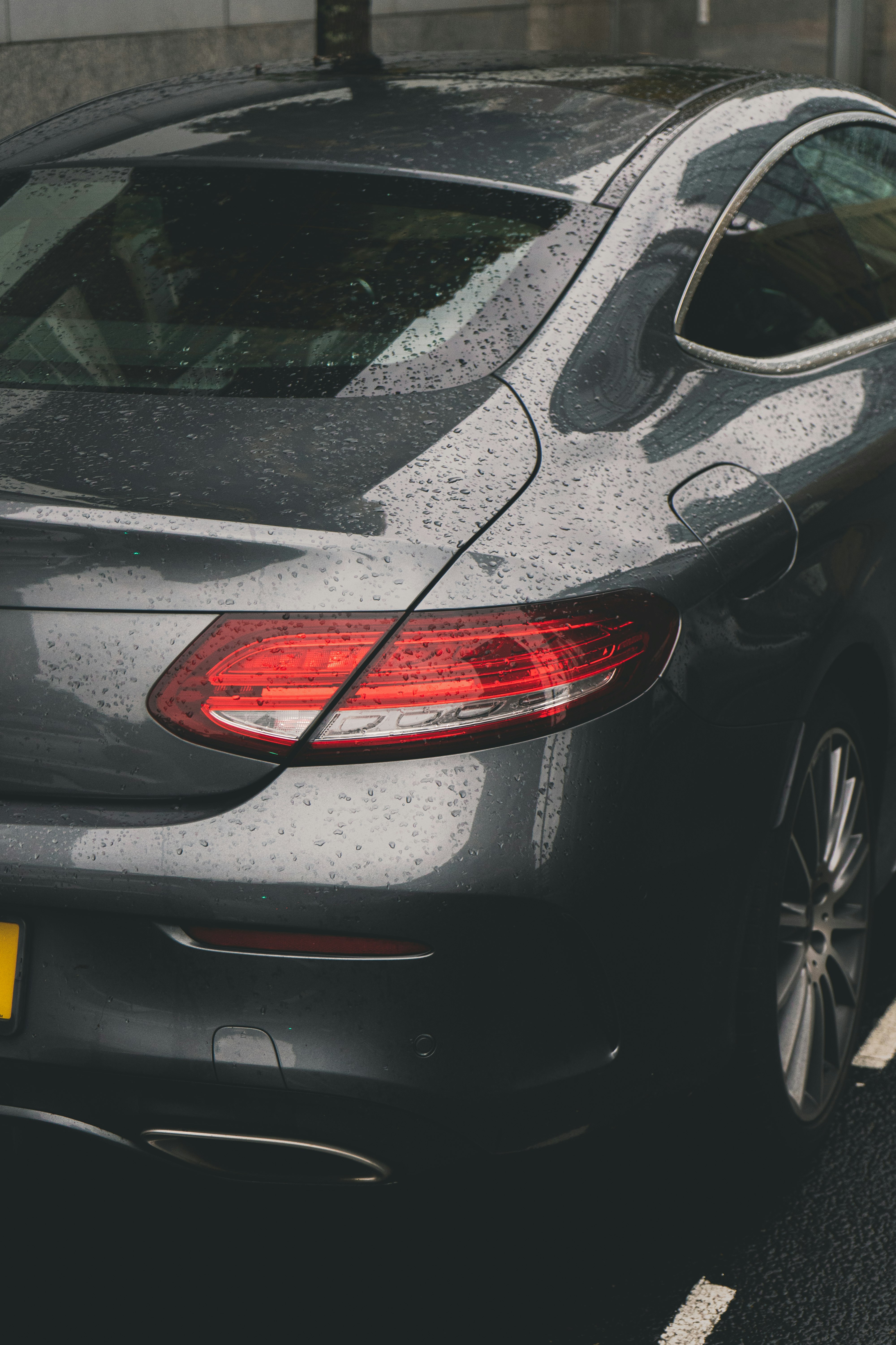 black car with red and yellow tail light