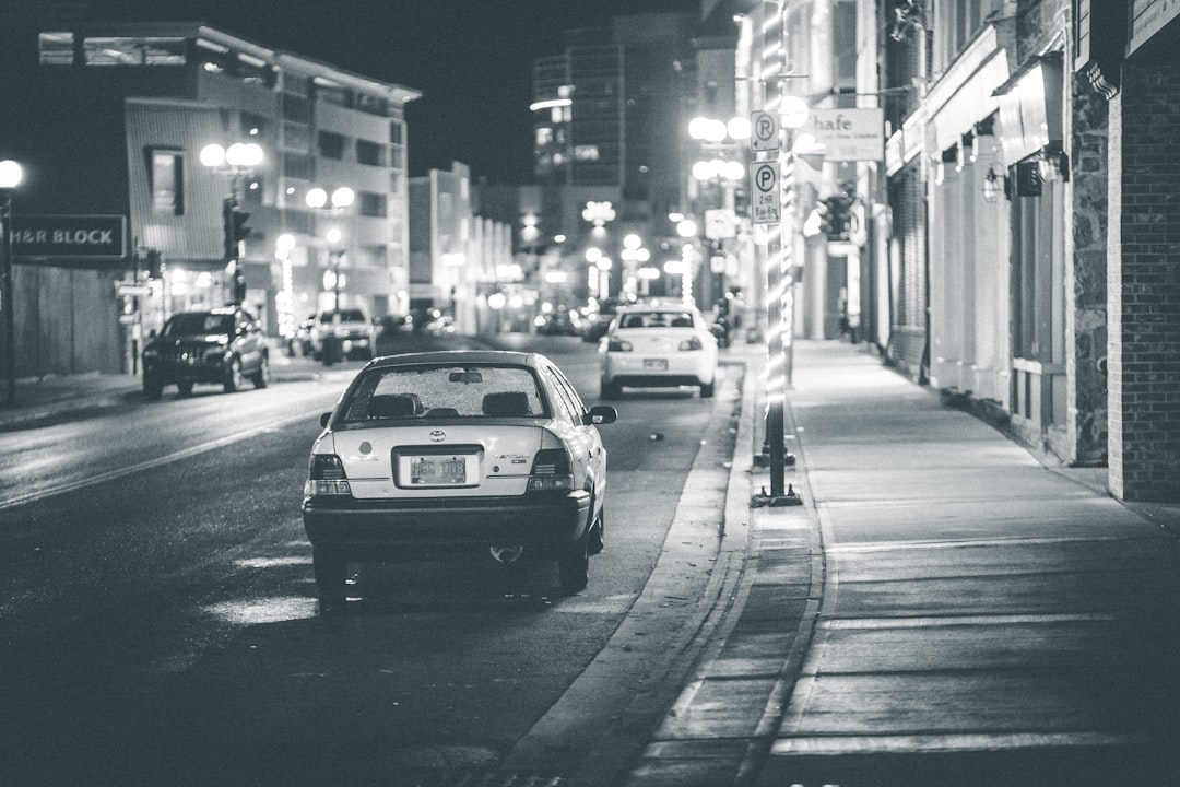 grayscale photo of car on road