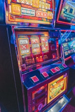 slot machine with lights turned on in the dark