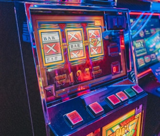 slot machine with lights turned on in the dark