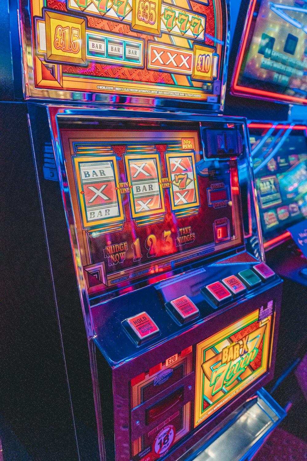 slot machine with lights turned on in the dark