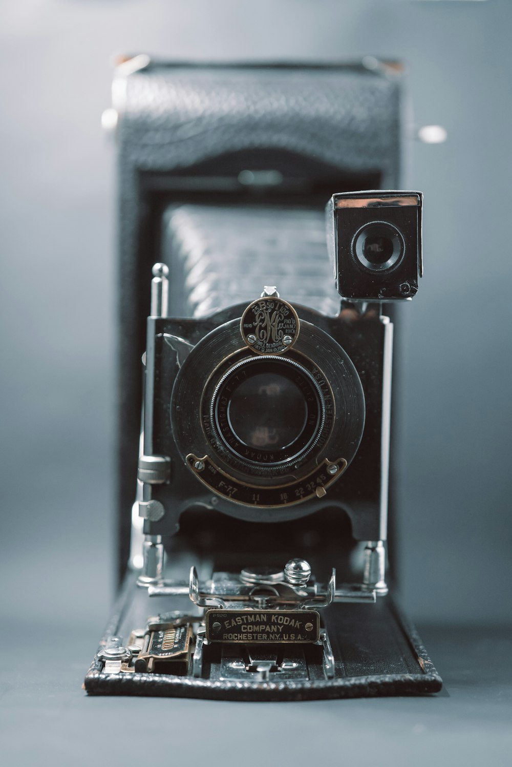 black and silver camera in blue textile