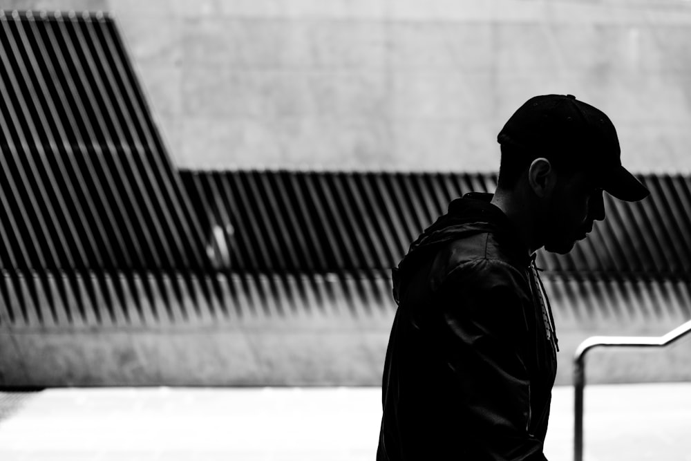 man in black jacket and black cap