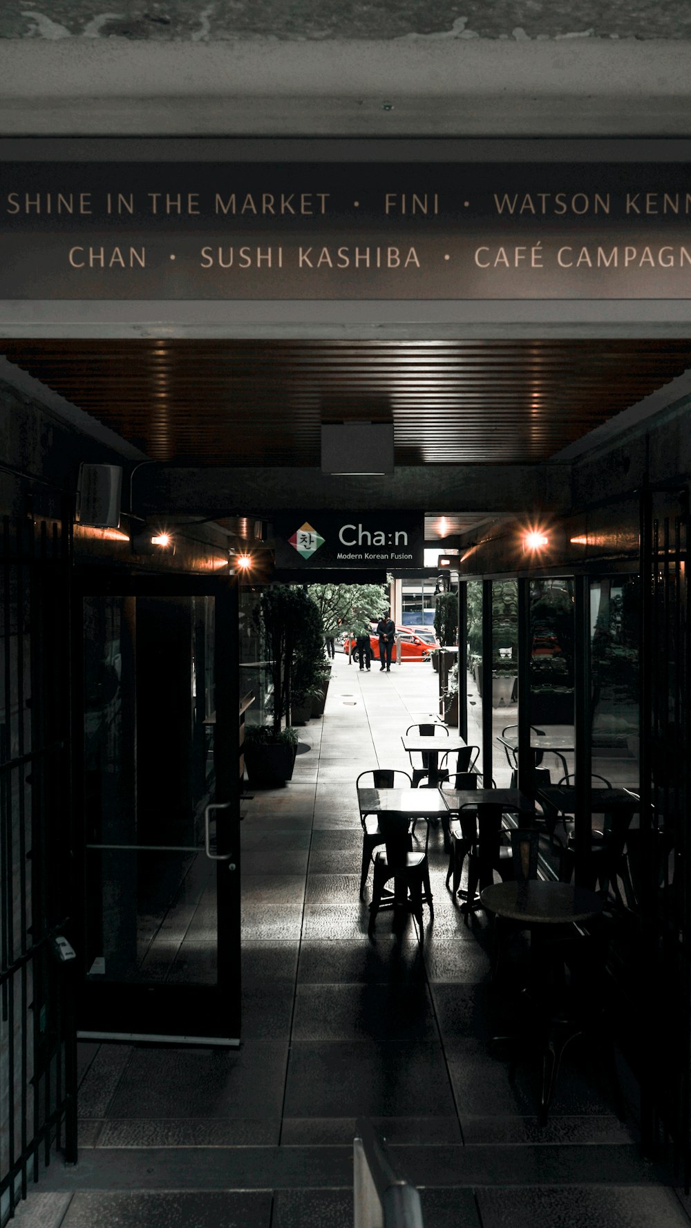 people sitting on chair outside restaurant during night time