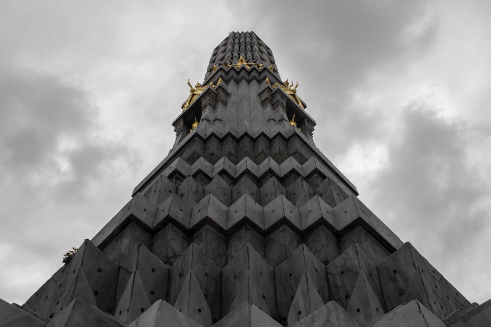 gray concrete building under white clouds during daytime