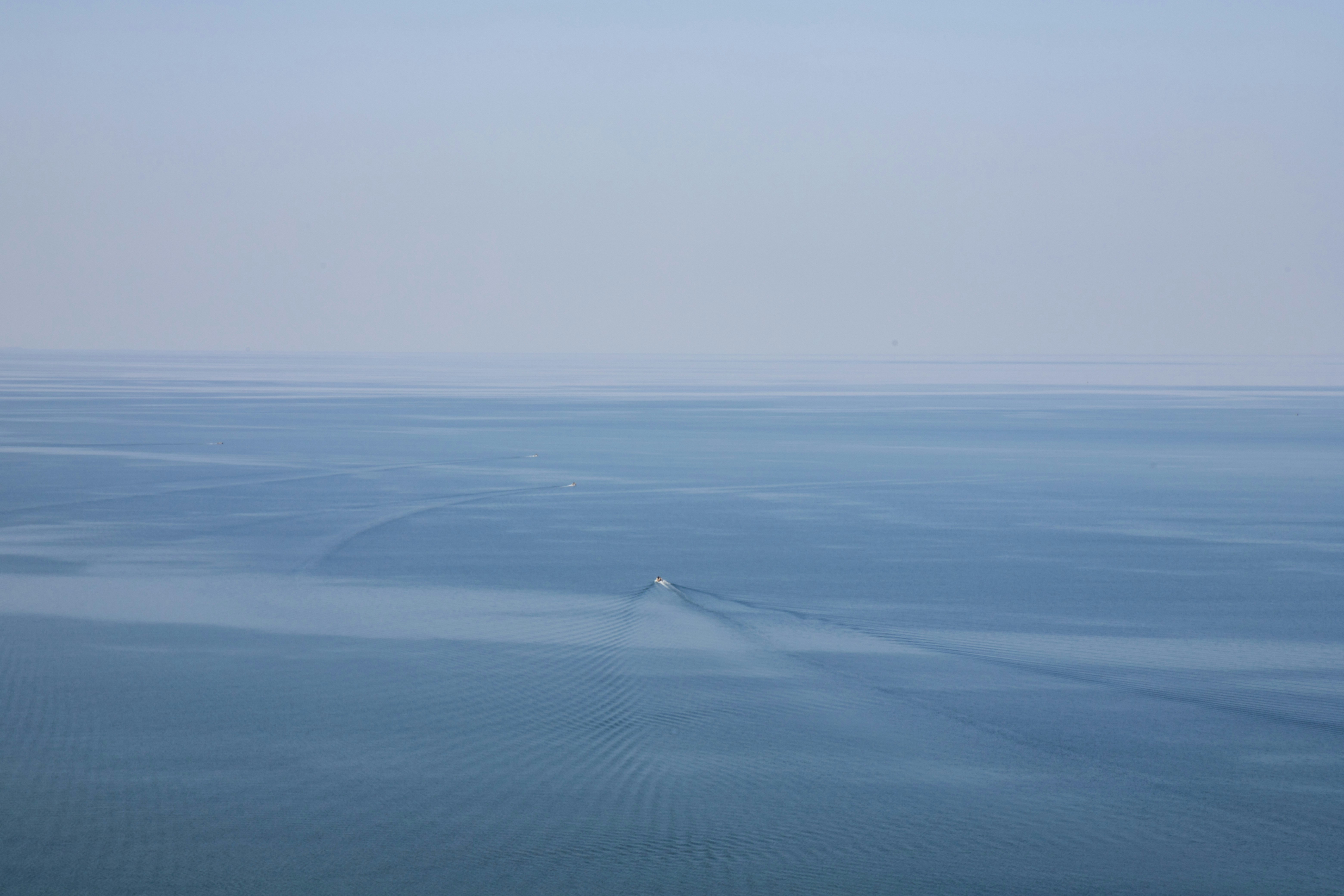 blue sea under white sky during daytime