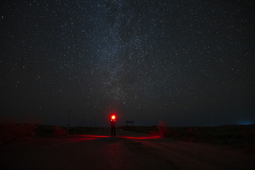 black car on road during night time