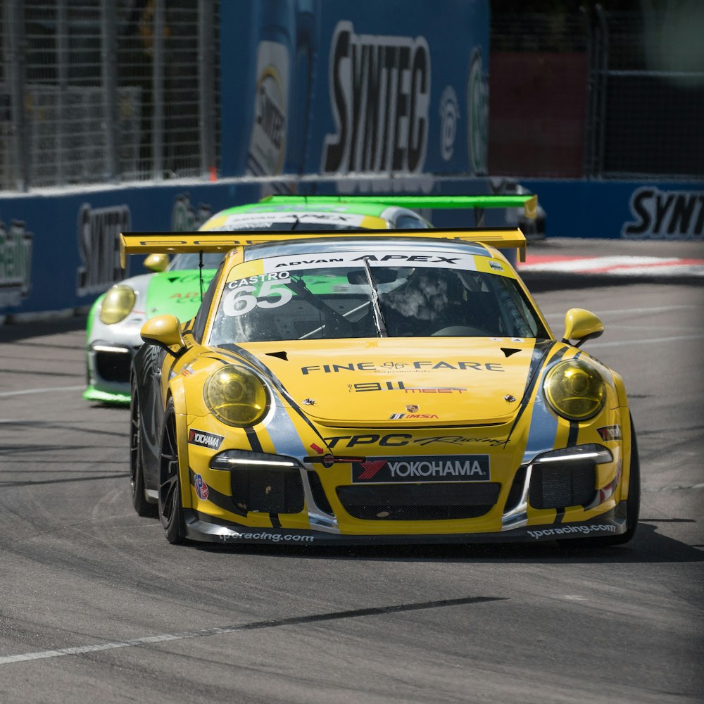 yellow and black porsche 911 on road during daytime