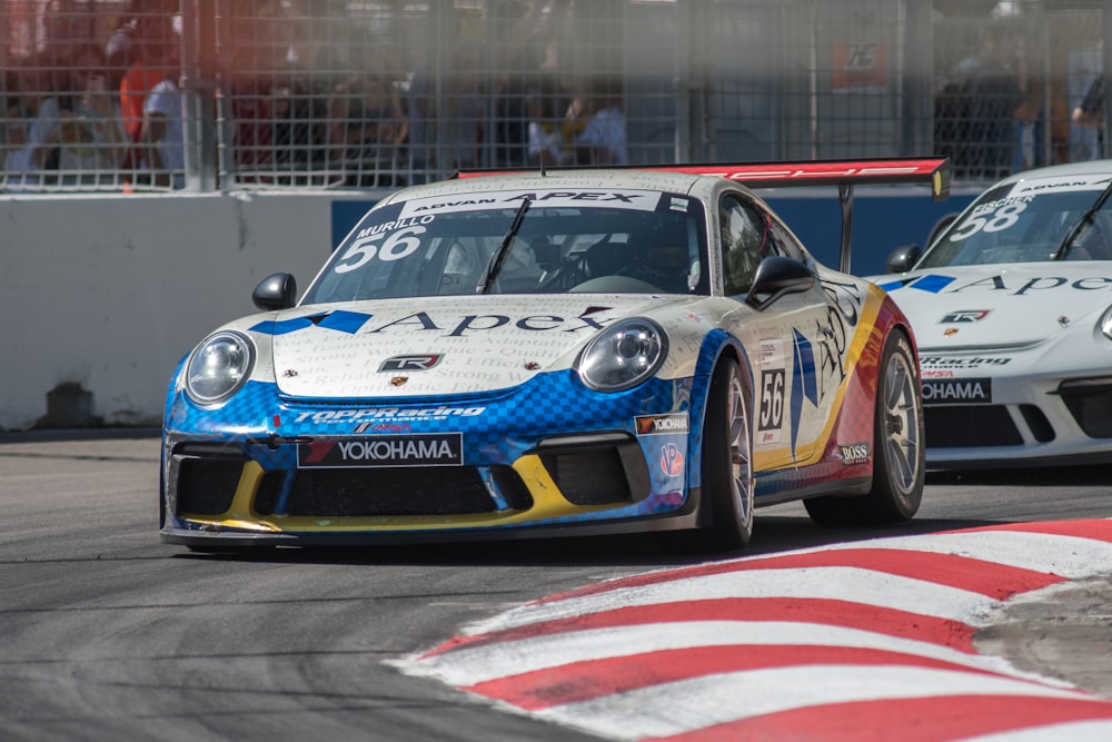 blue and white porsche 911