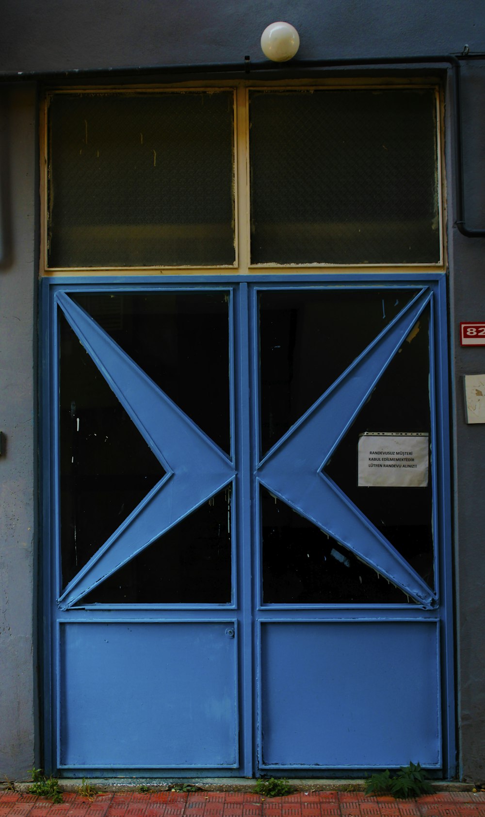 blue wooden framed glass window