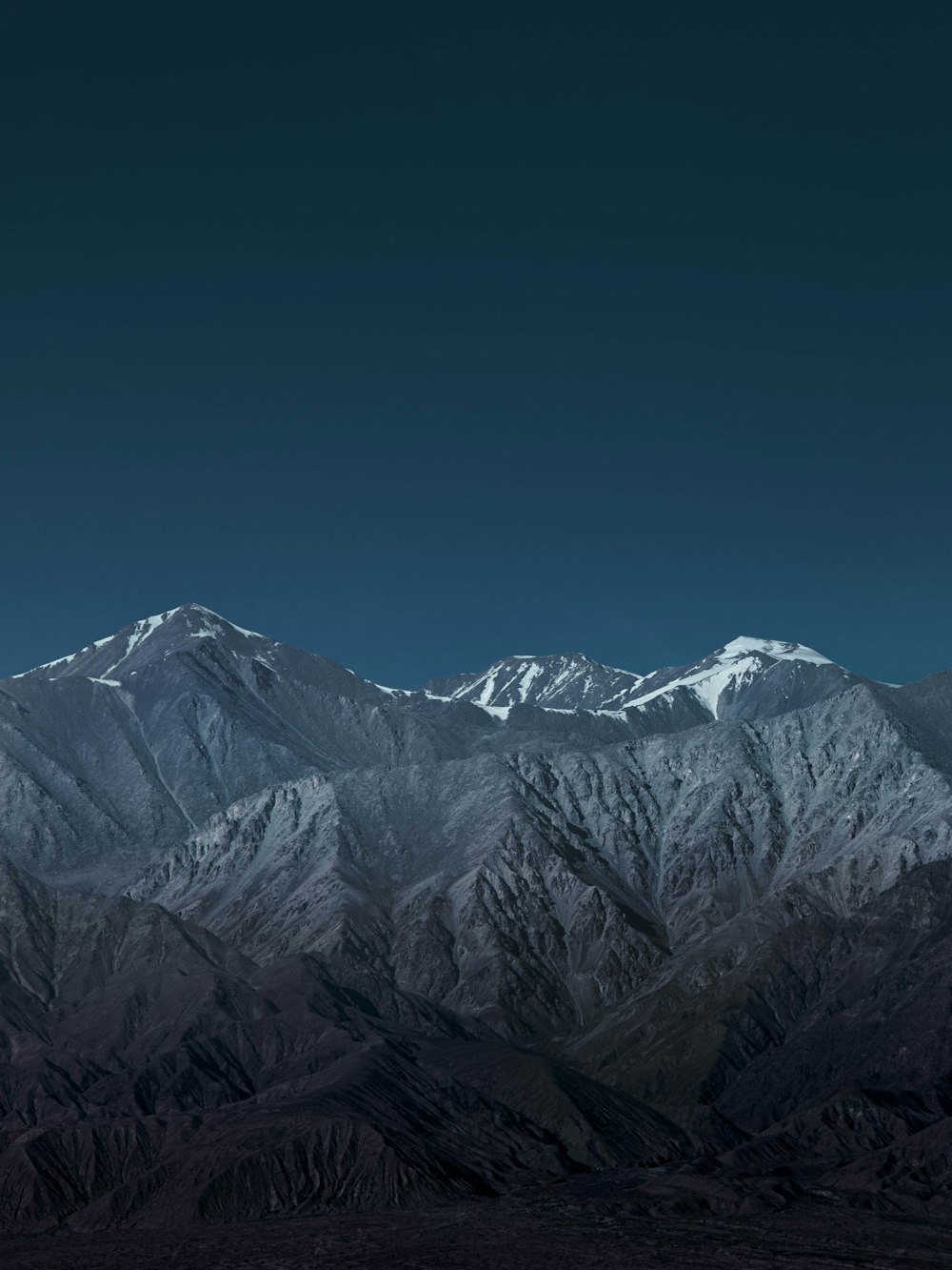 snow covered mountain under blue sky during daytime