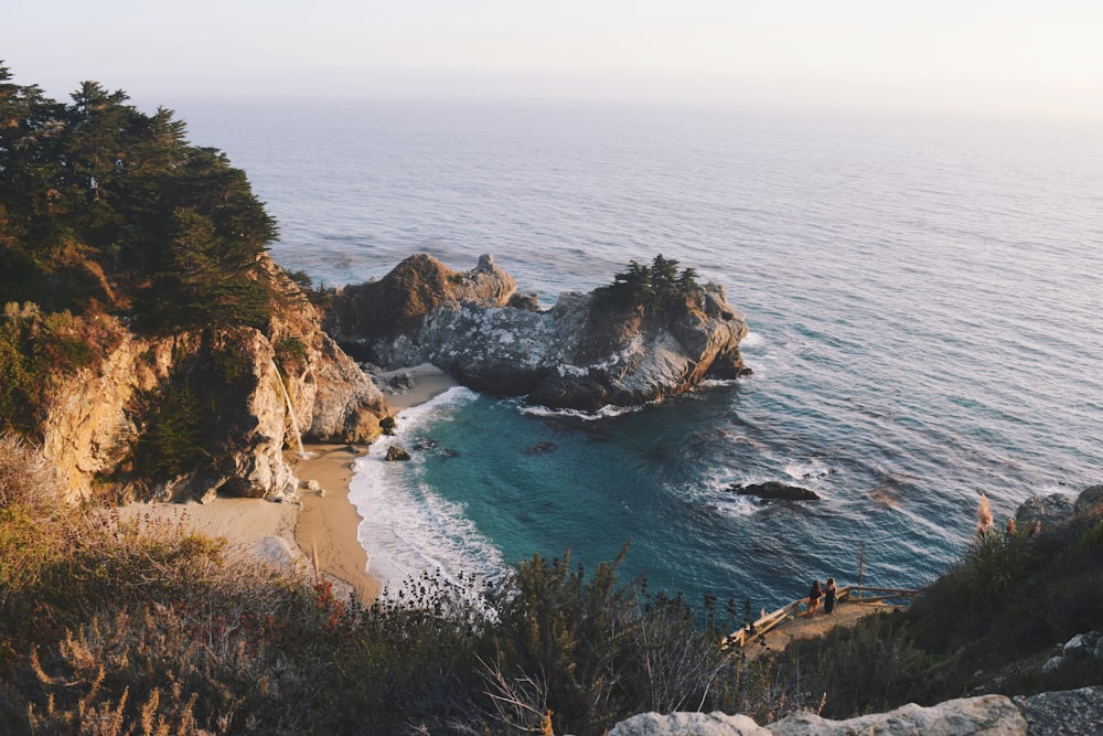 brown rock formation on sea during daytime