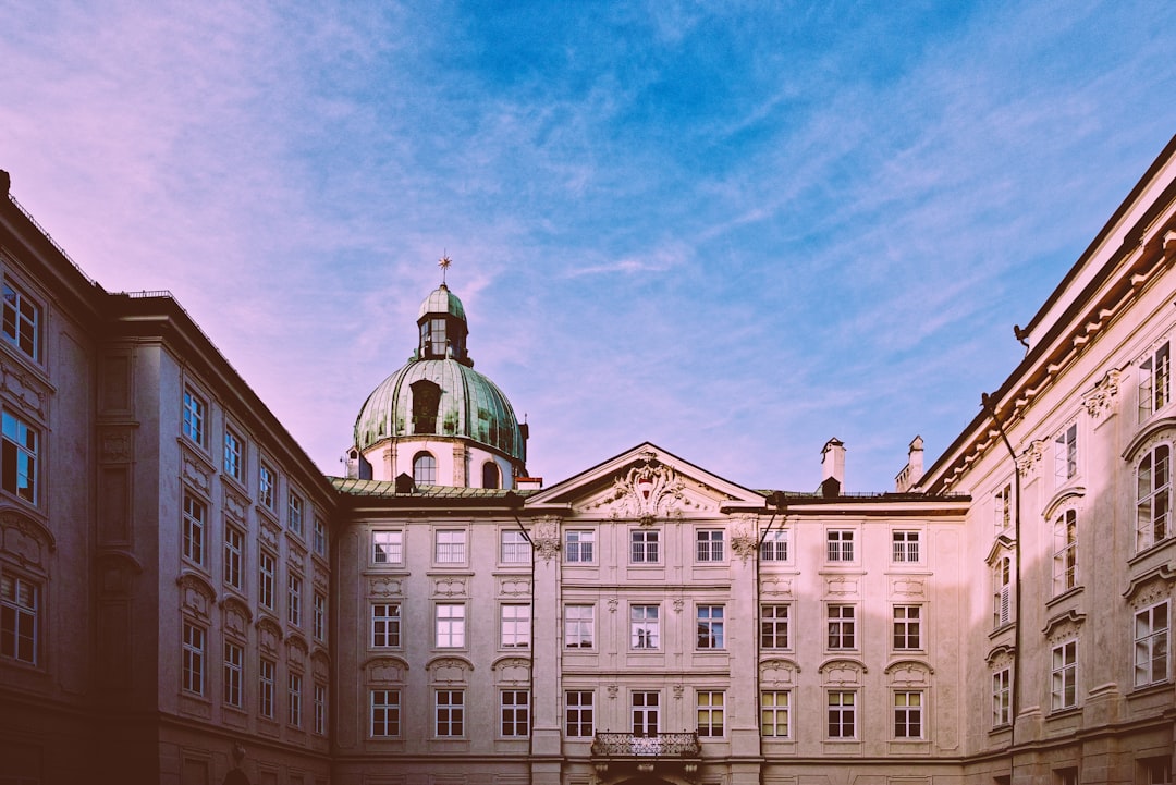 white and green concrete building under blue sky during daytime