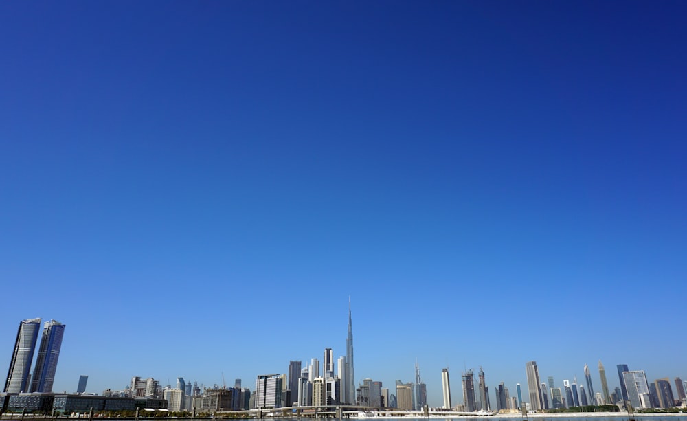 city skyline under blue sky during daytime