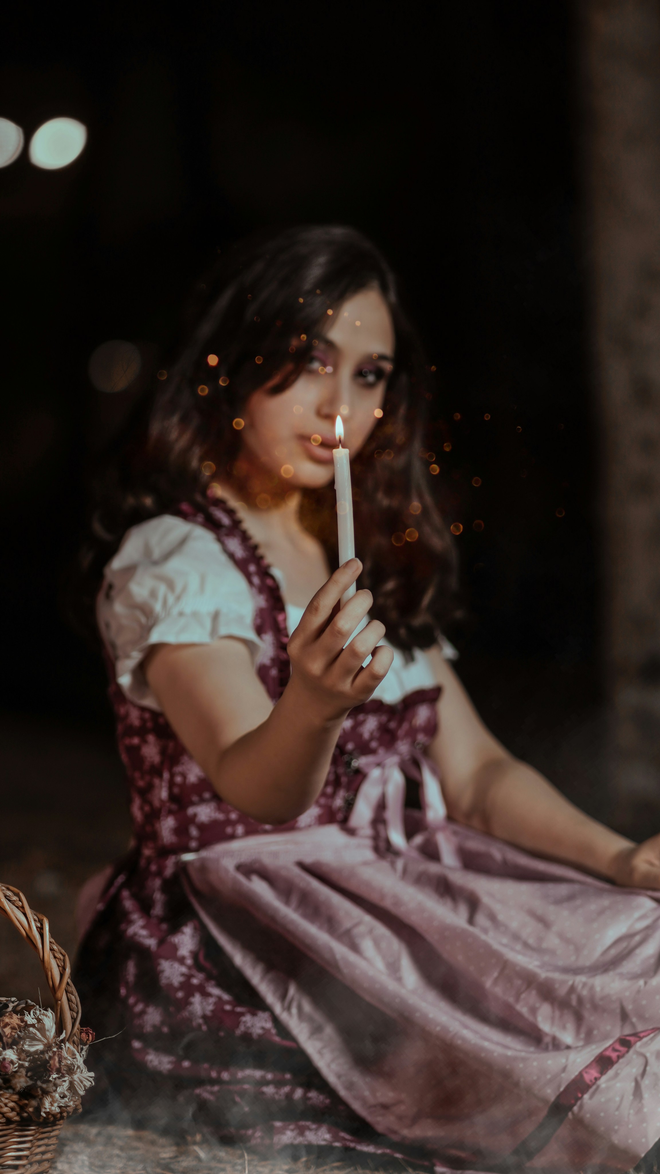 girl in white and purple dress holding white stick