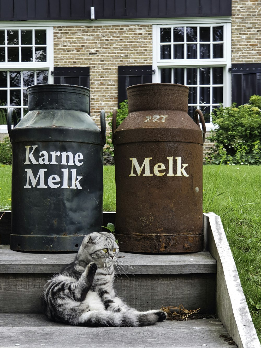 brown steel container on green grass field during daytime