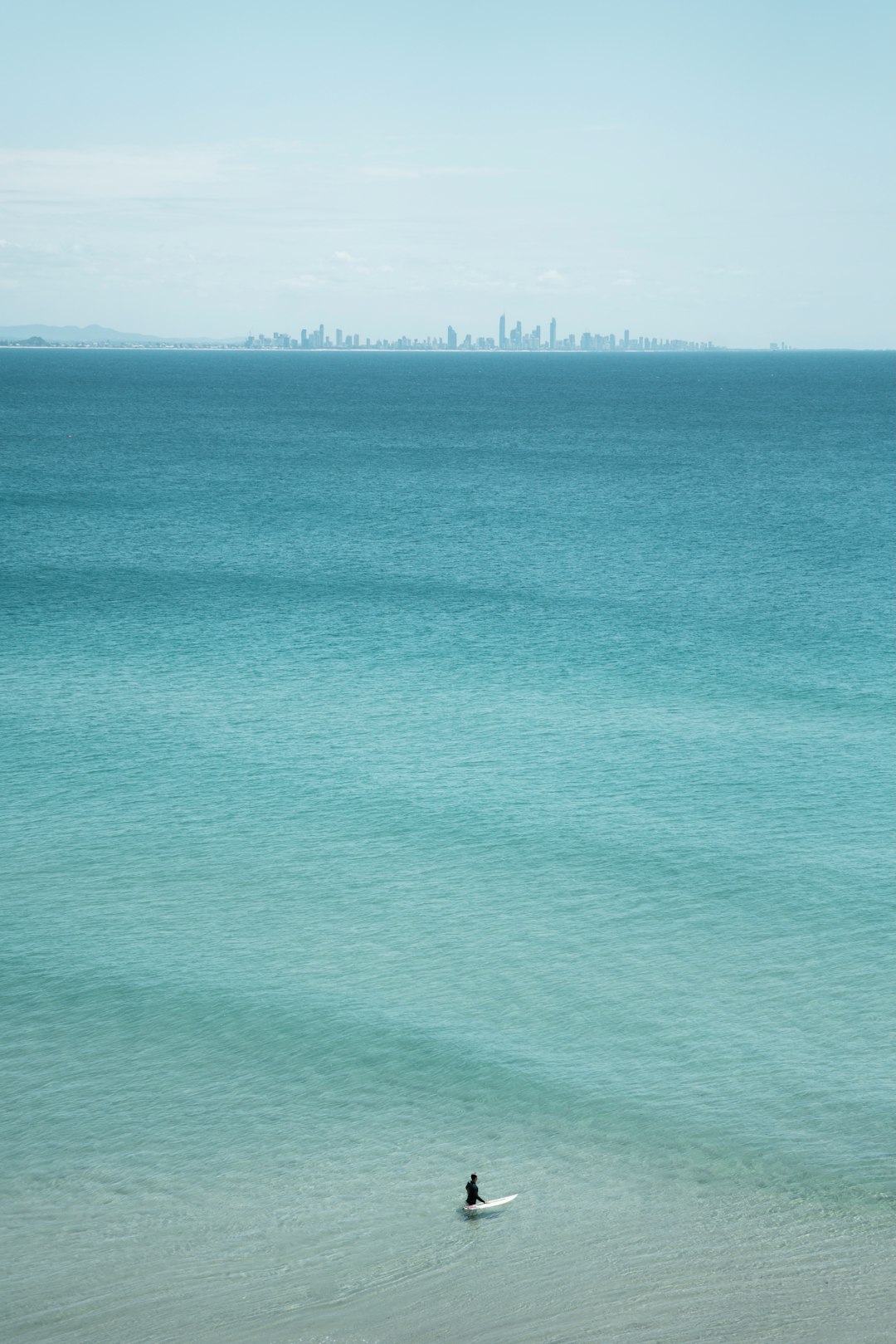 green ocean under blue sky during daytime