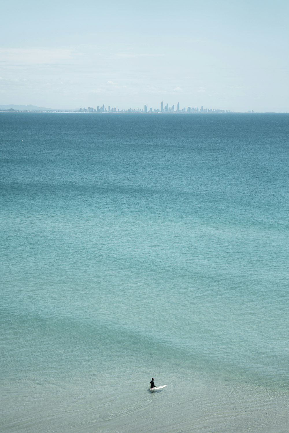 green ocean under blue sky during daytime