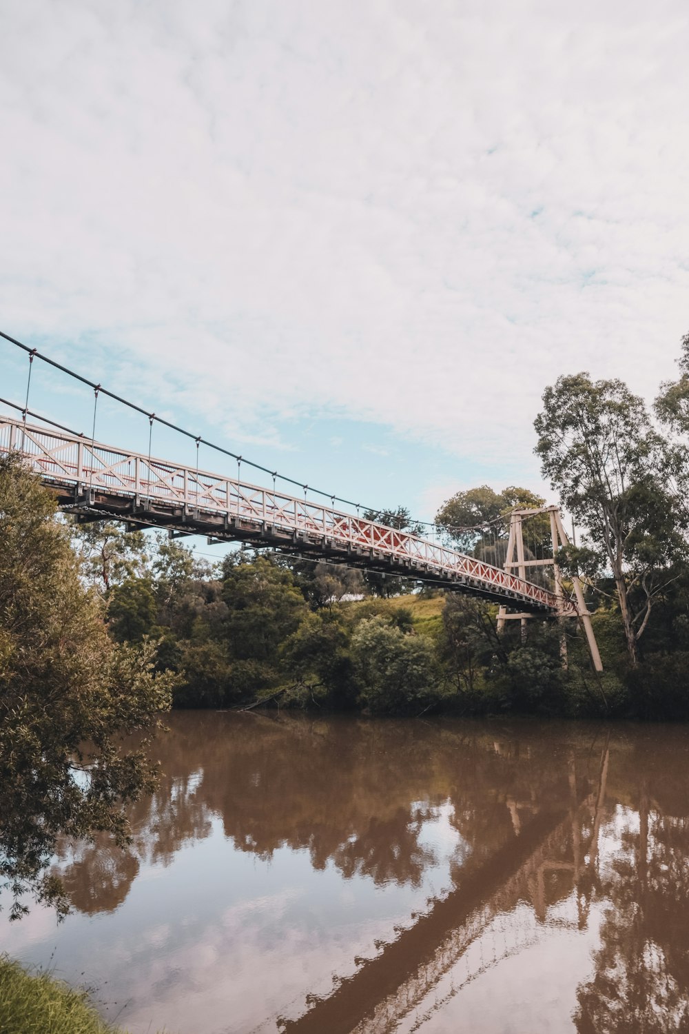 gray bridge over river during daytime
