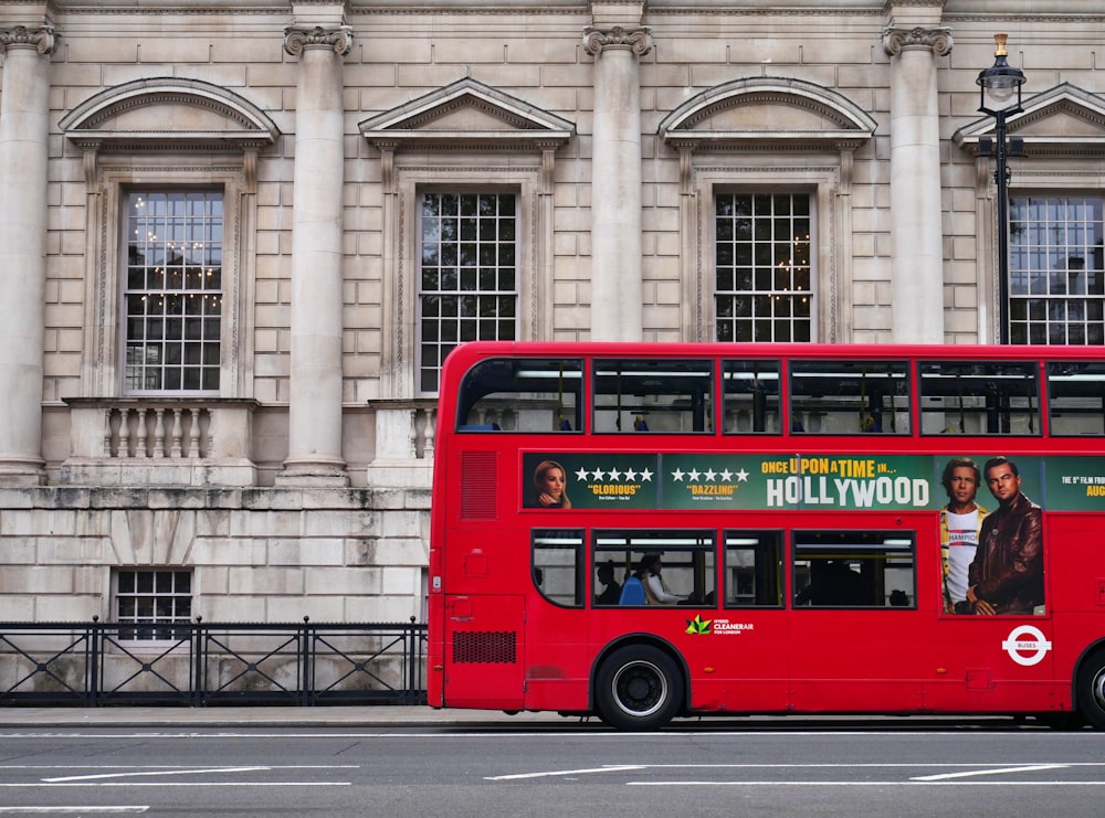 red double decker bus on road during daytime