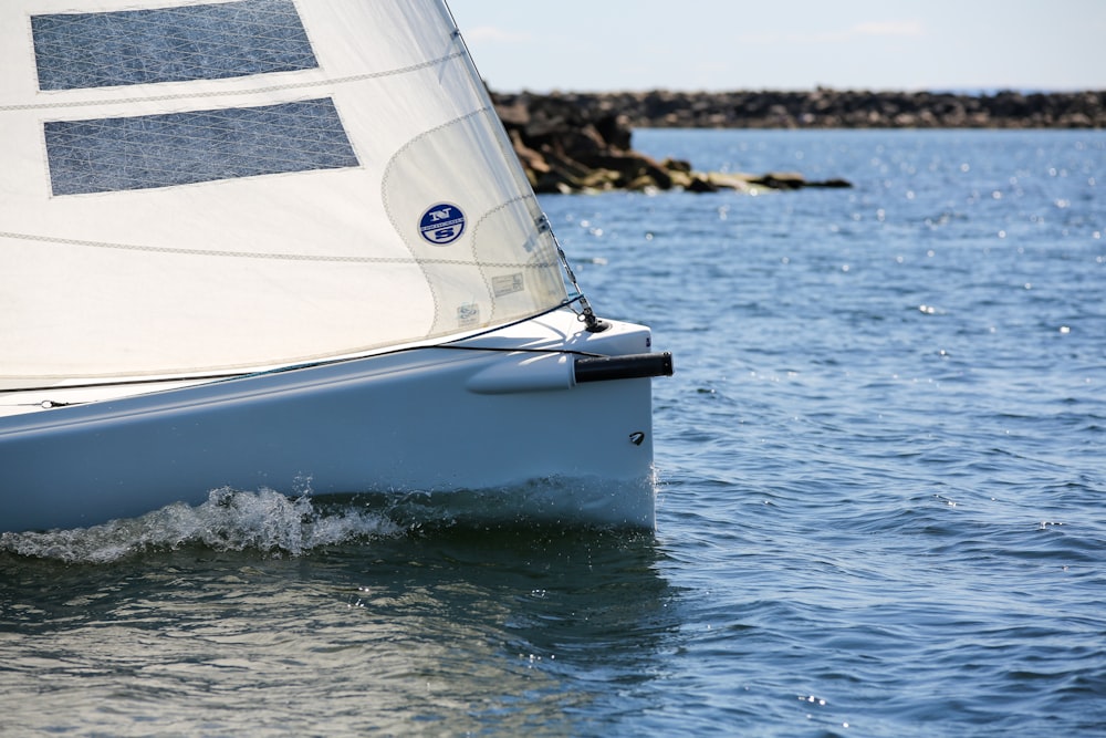 white sailboat on sea during daytime