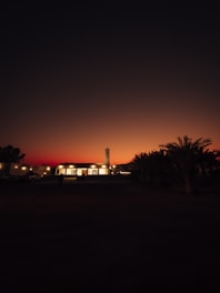 A serene landscape of a mosque at sunset, symbolizing peace and spirituality.