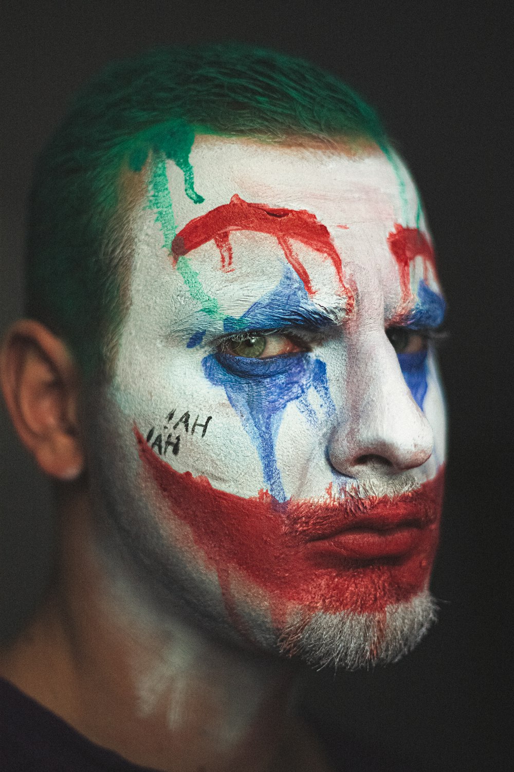 man with blue and red face paint