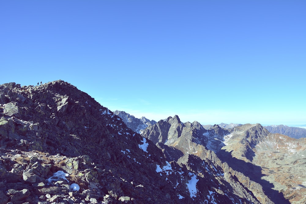 rocky mountain under blue sky during daytime