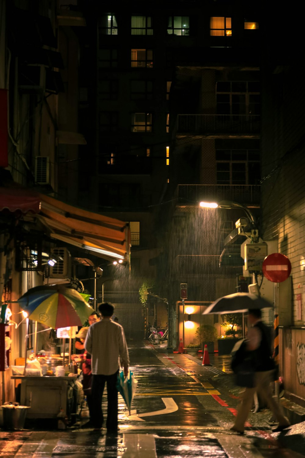 people walking on street during night time