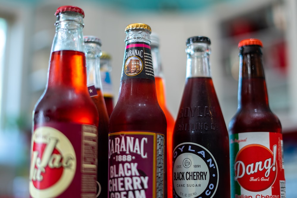 three red and white labeled bottles