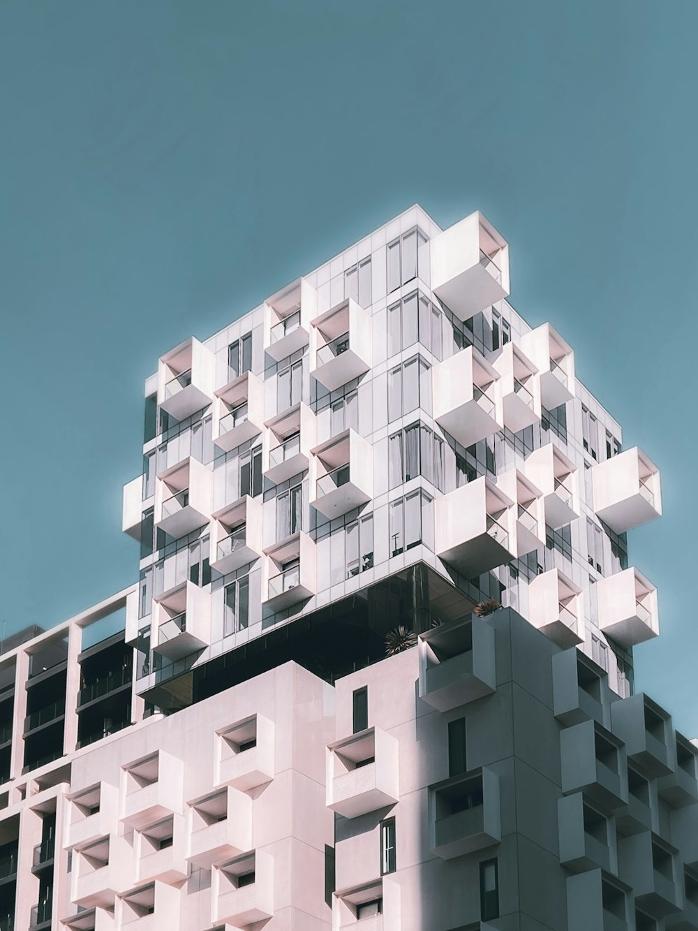 white concrete building under blue sky during daytime