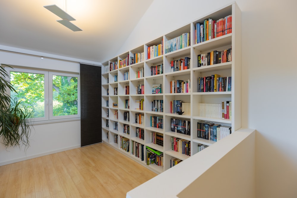 books on brown wooden shelf