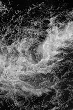 water waves in grayscale photography