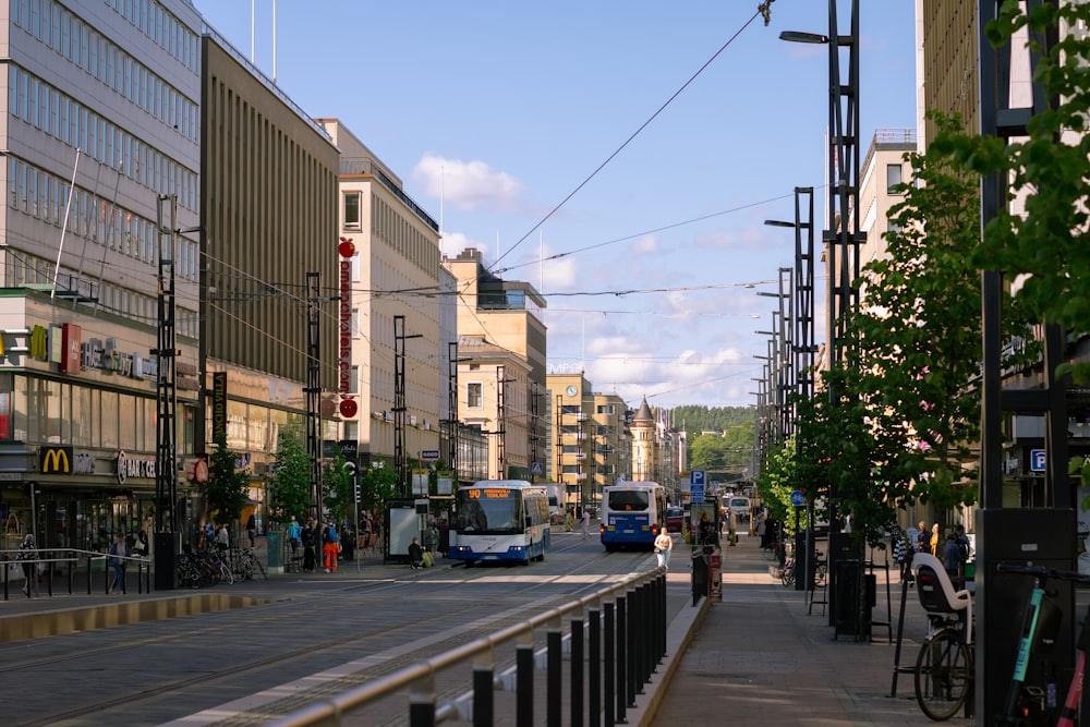 cars parked on side of the road near buildings during daytime