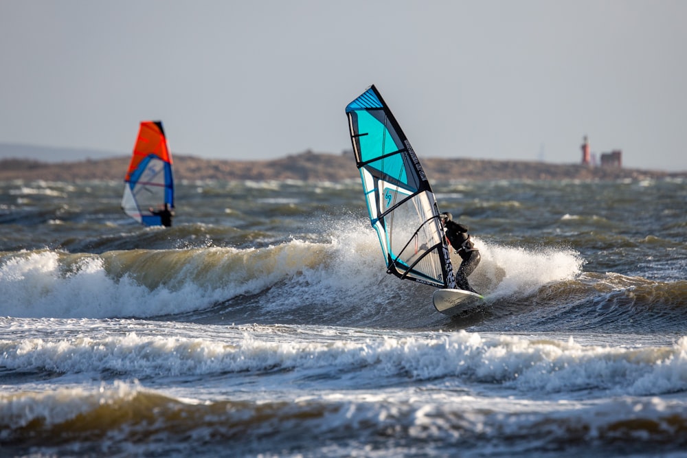 person surfing on sea waves during daytime