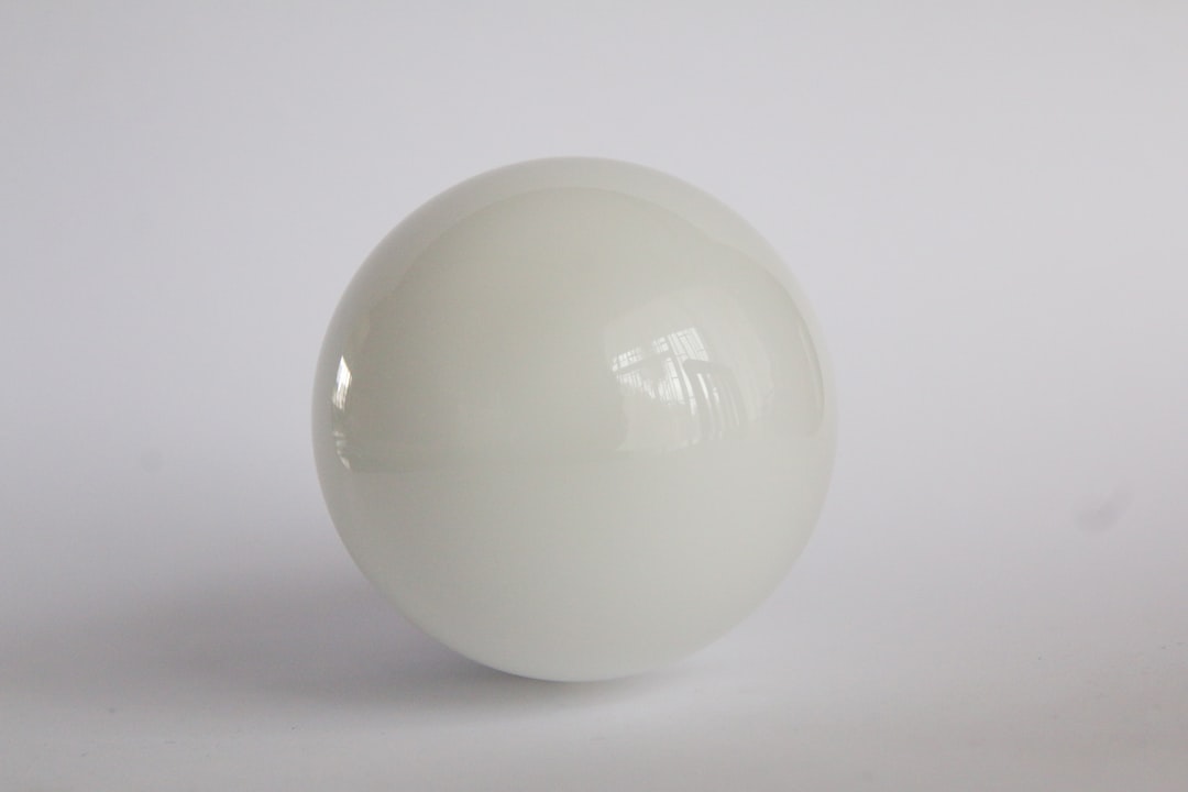 white egg on white surface