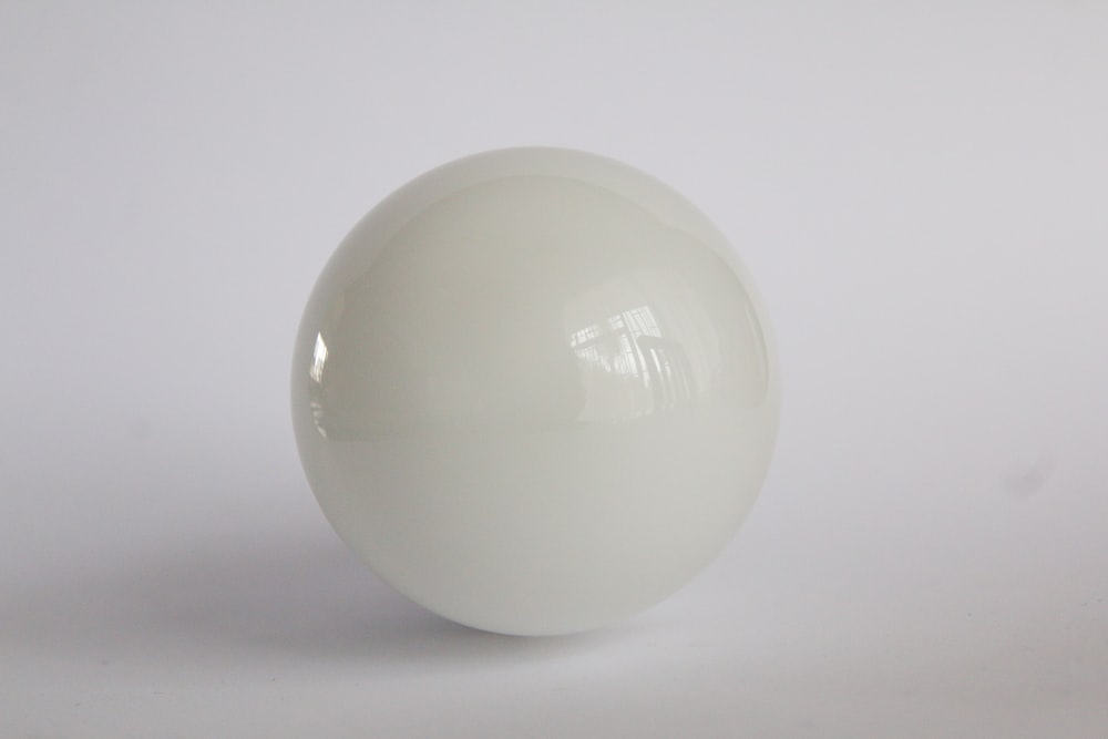 white egg on white surface