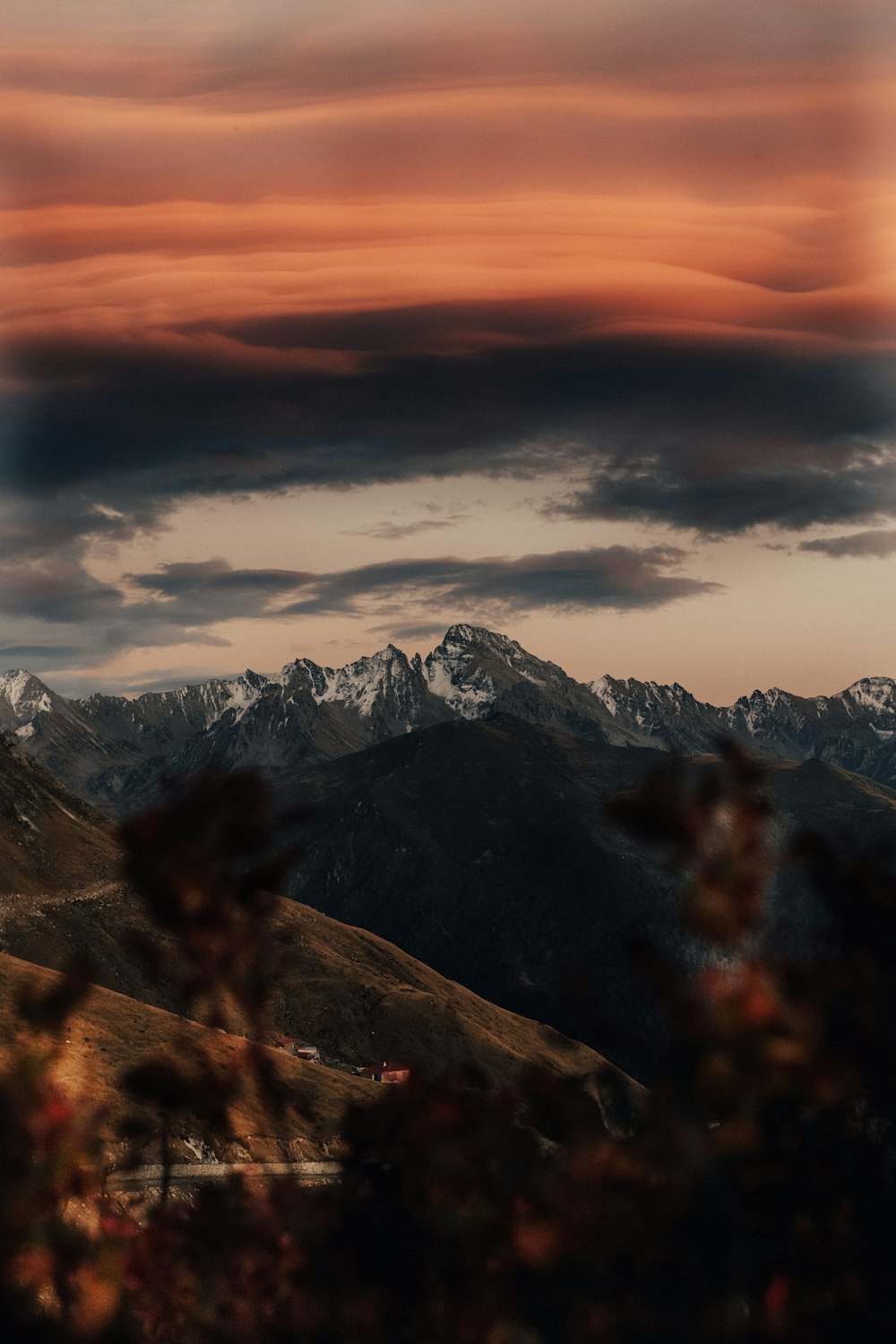 snow covered mountain under cloudy sky during daytime