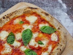 pizza with green leaf on top